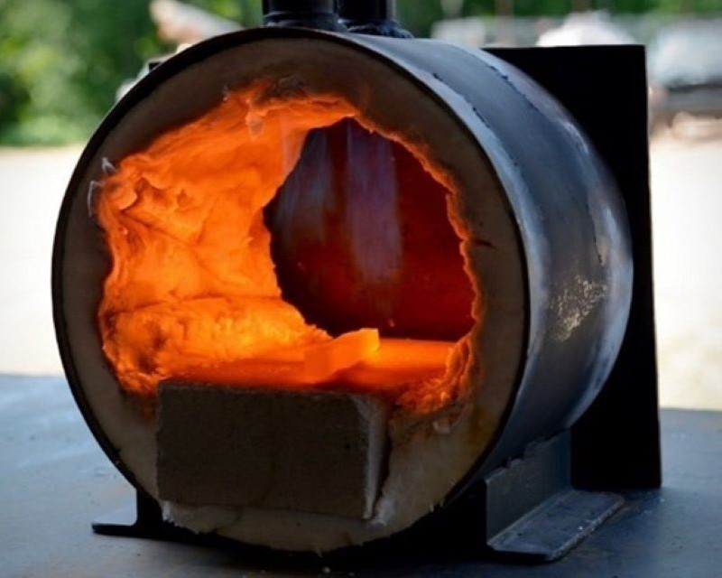 The propane forge radiates red-hot